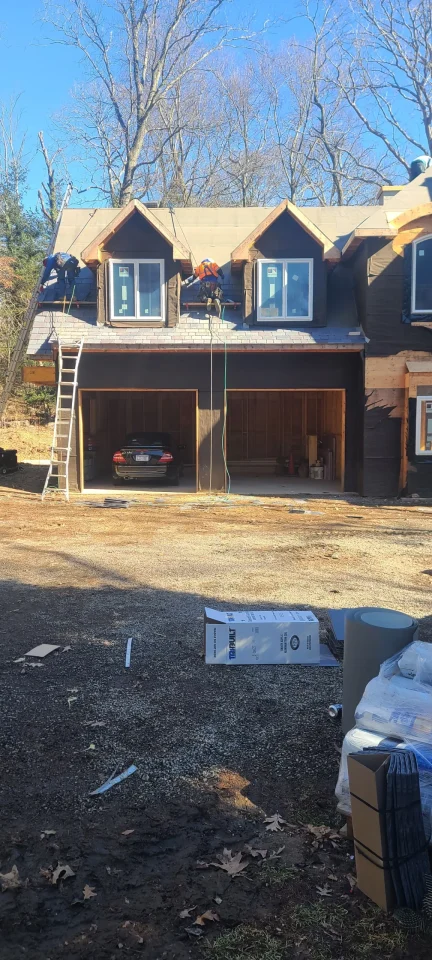 a man climbing up a ladder in a garage