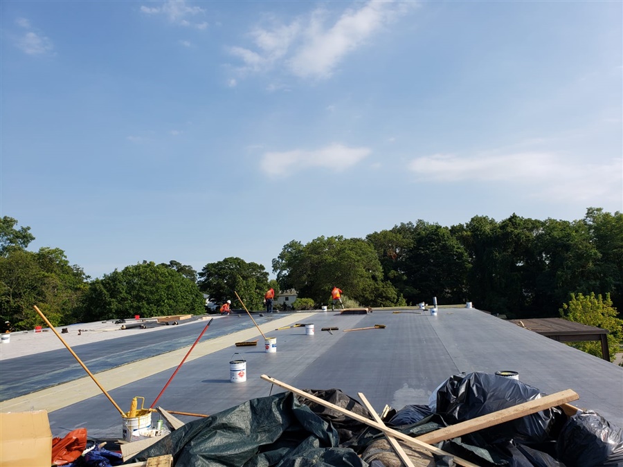 a group of workers on a roof