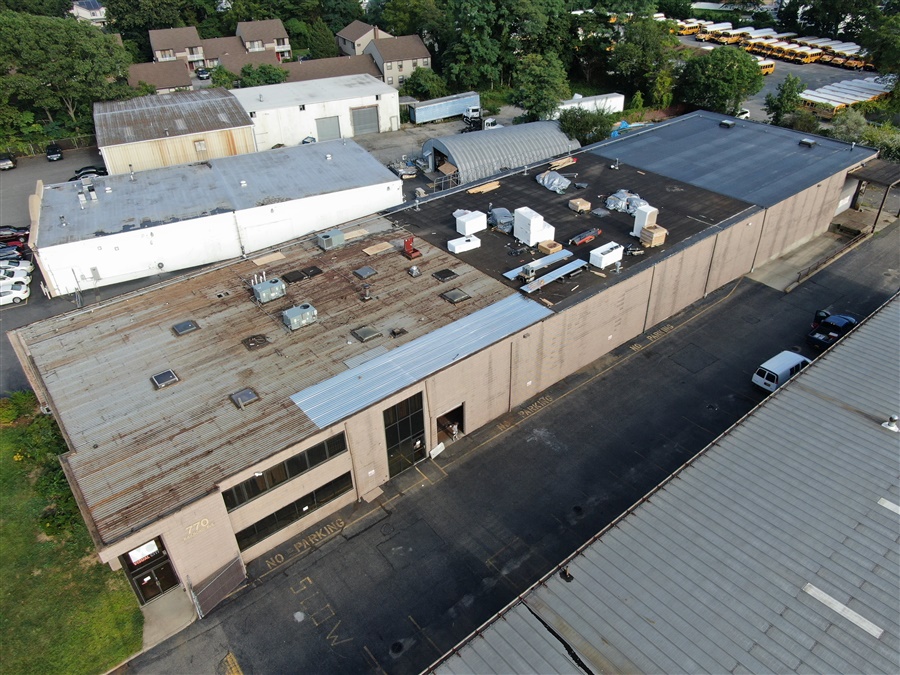 a building with many windows and a parking lot