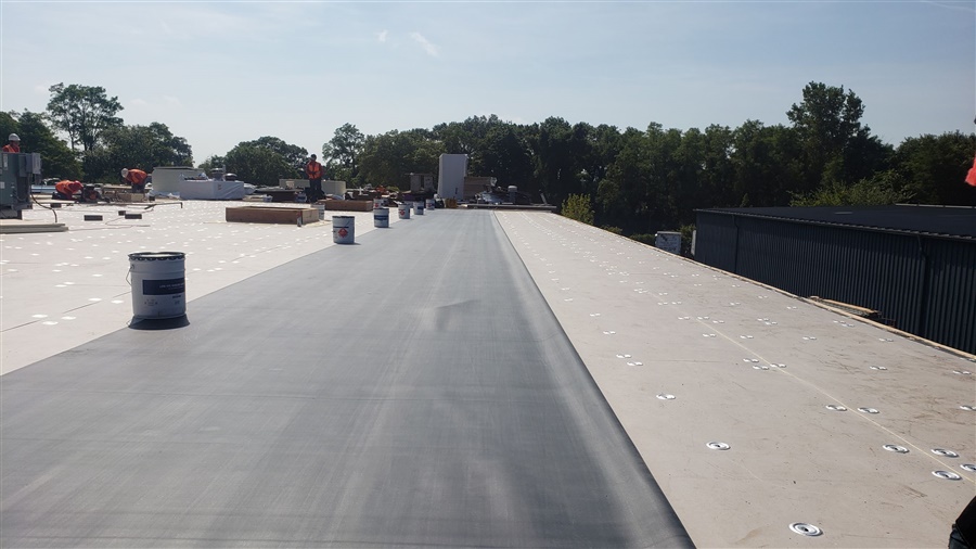 a roof with a man standing on it
