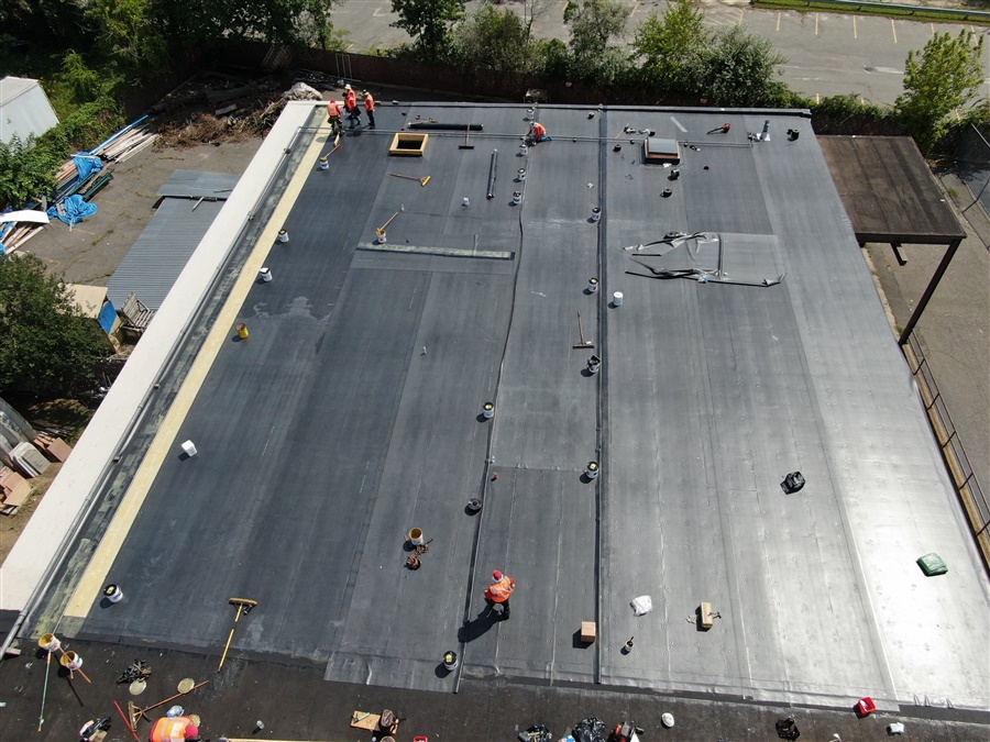 a roof with workers on it
