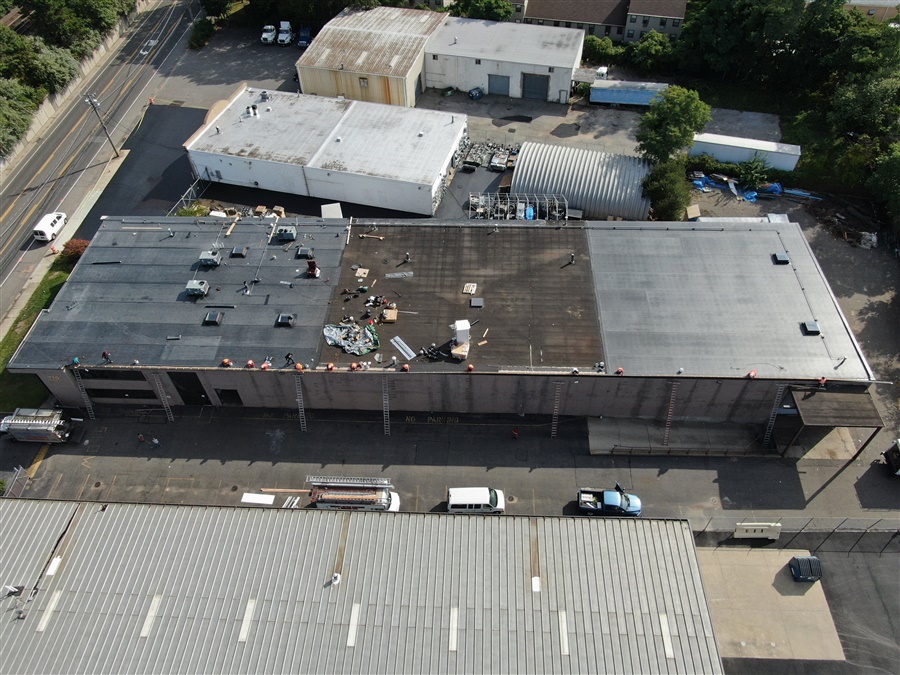 a building with many cars parked in front of it